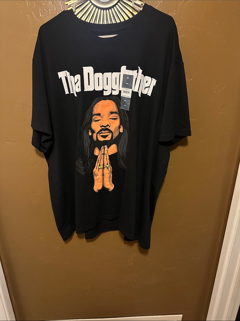 Black Short-Sleeve Graphic Tee with Praying Figure Print
